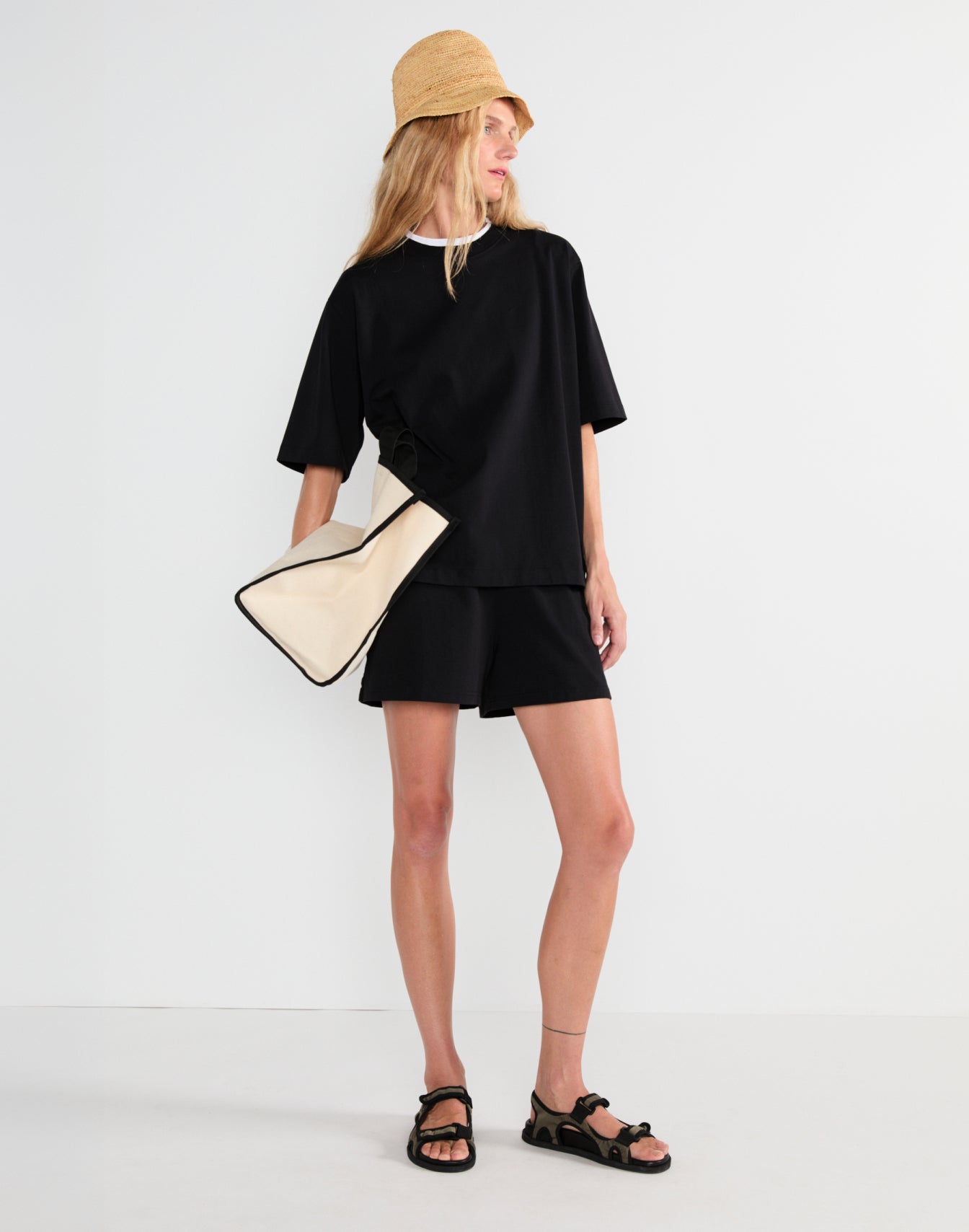 Model wearing The Mercer - Black and The Delia - Black