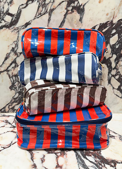 Stack of KULE cosmetic bags