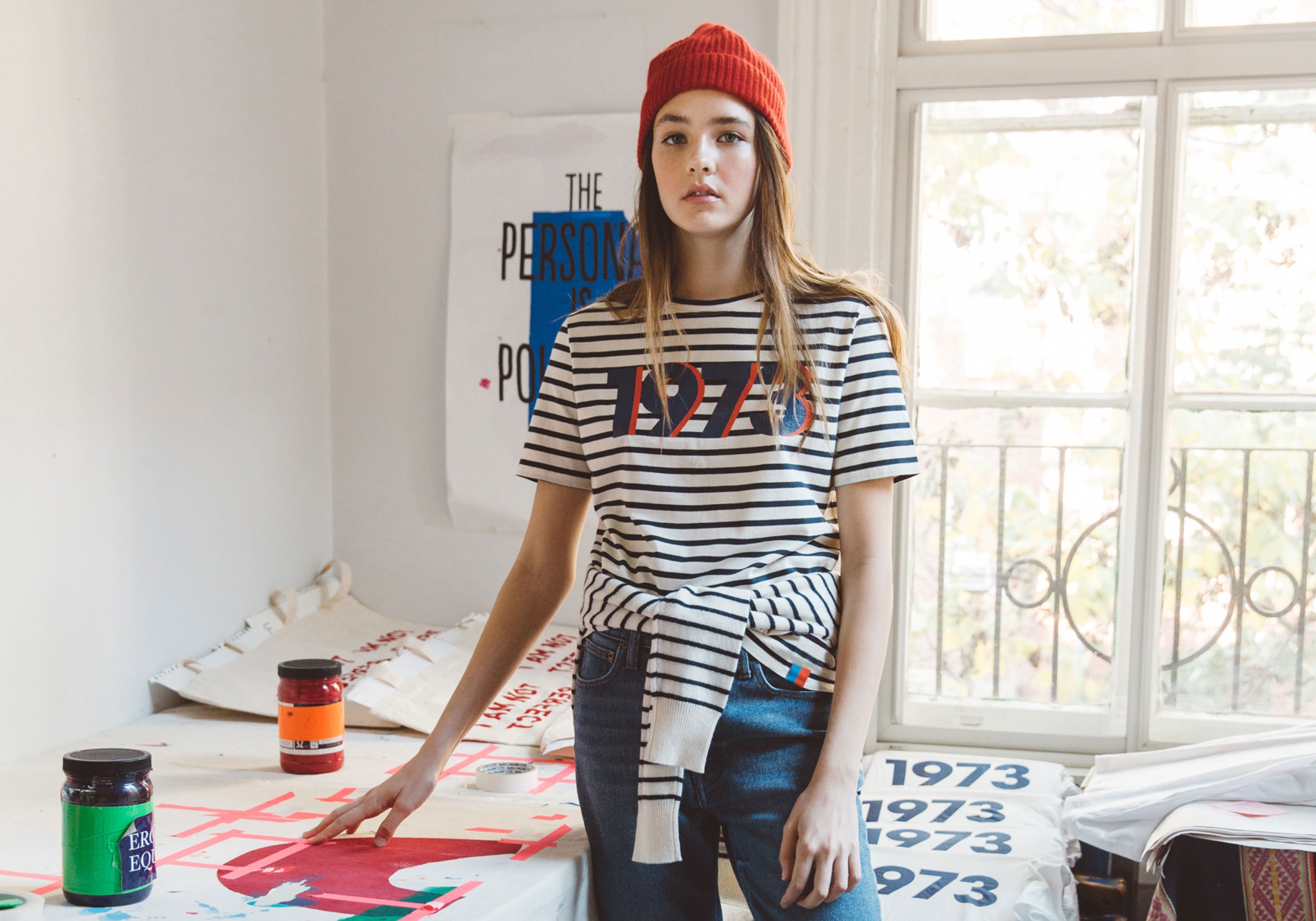 Model wearing The Modern 1973 Tee in cream/navy stripe